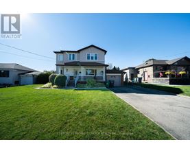 A house with a lawn in front of it is for sale.