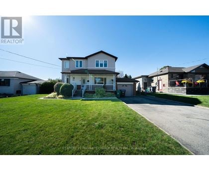 A house with a lawn in front of it is for sale.