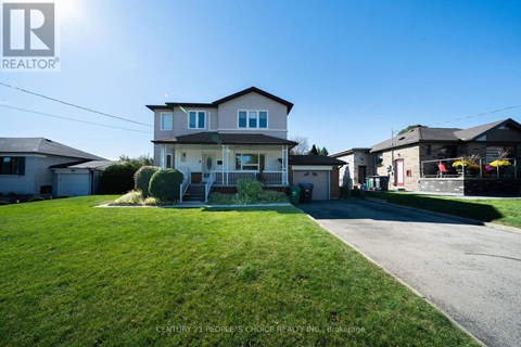 A house with a lawn in front of it is for sale.