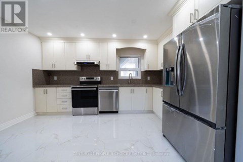 A modern kitchen with stainless steel appliances and white marble flooring.