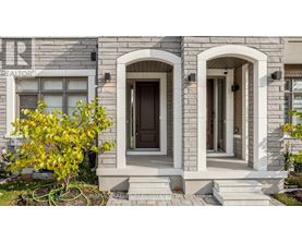 A house with a stone facade and a brown door.