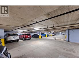 A parking garage with cars parked in it.