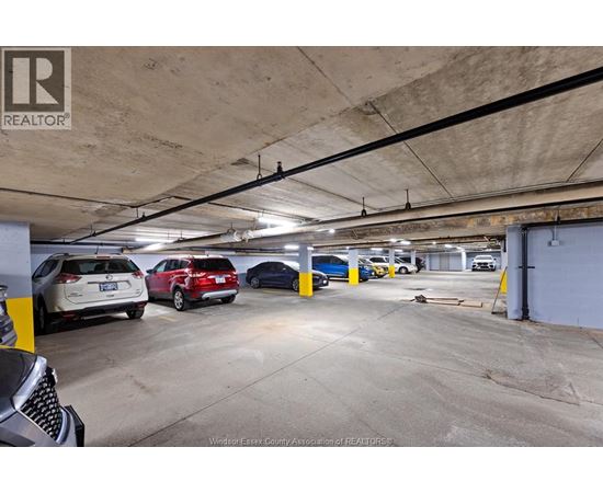 A parking garage with cars parked in it.