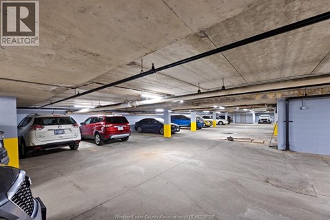 A parking garage with cars parked in it.