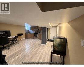 A living room with a television and a fish tank.