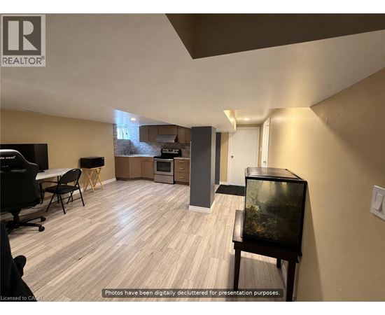 A living room with a television and a fish tank.