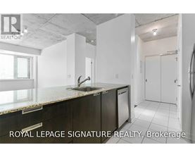 A kitchen with a sink and a window.