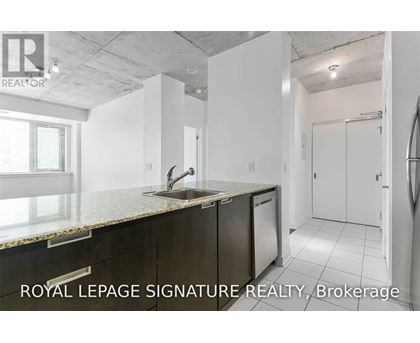 A kitchen with a sink and a window.