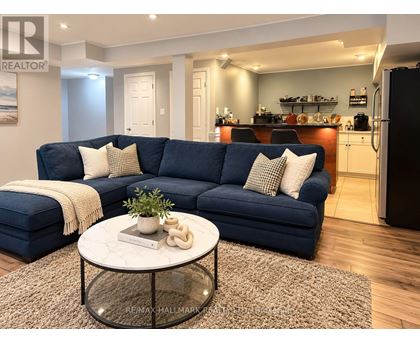 A living room with a blue couch and a coffee table.