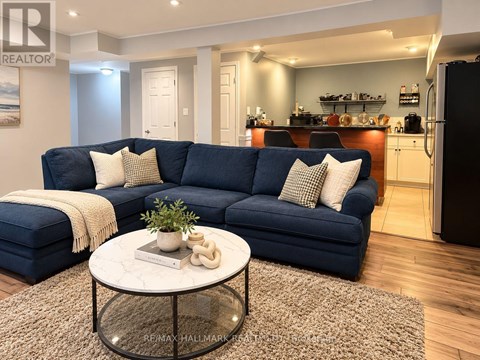 A living room with a blue couch and a coffee table.