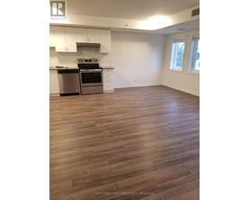 A kitchen with white cabinets and a stainless steel dishwasher.