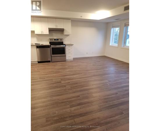 A kitchen with white cabinets and a stainless steel dishwasher.