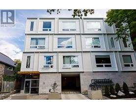 A modern building with the number 22 on the front door.