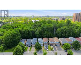 A bird's eye view of a residential area with houses and trees.