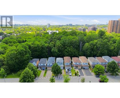 A bird's eye view of a residential area with houses and trees.