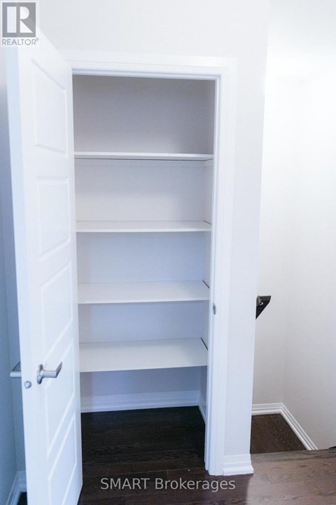 A white doorway with shelves inside.