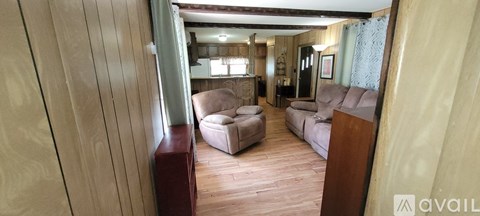 A living room with a couch and a chair.