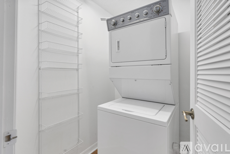 A white oven with a door open in a kitchen.