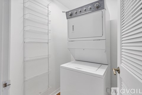 A white oven with a door open in a kitchen.