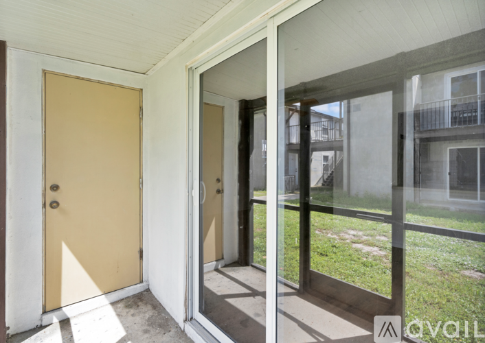 A yellow door is on the left and a glass door is on the right.