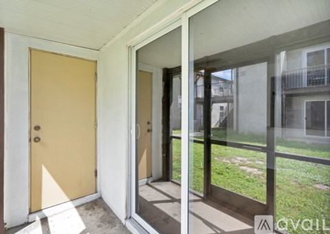 A yellow door is on the left and a glass door is on the right.