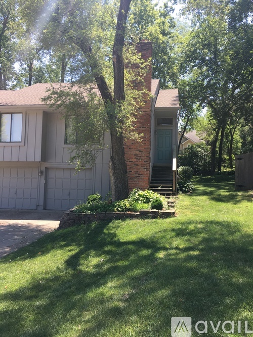 A house with a tree in front of it.