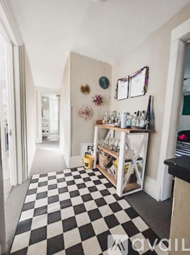 A black and white checkered floor in a room.