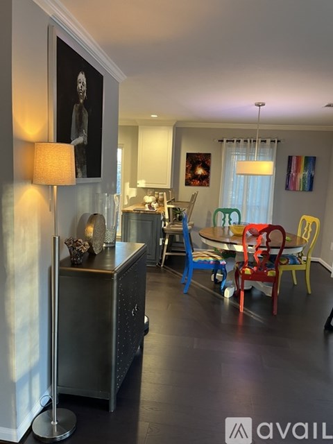 A modern kitchen with a dining table and chairs.