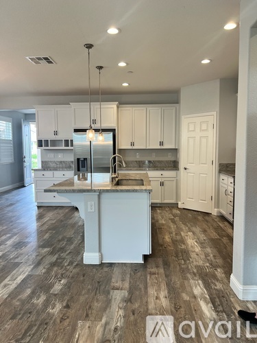 A kitchen with a large island in the middle.
