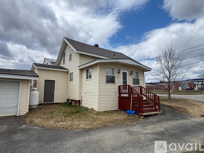 A house with a garage and a covered porch.