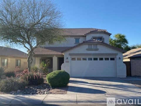 A house with a white garage door is for sale.