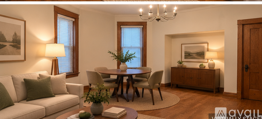 A well-lit living room with a dining table and chairs.