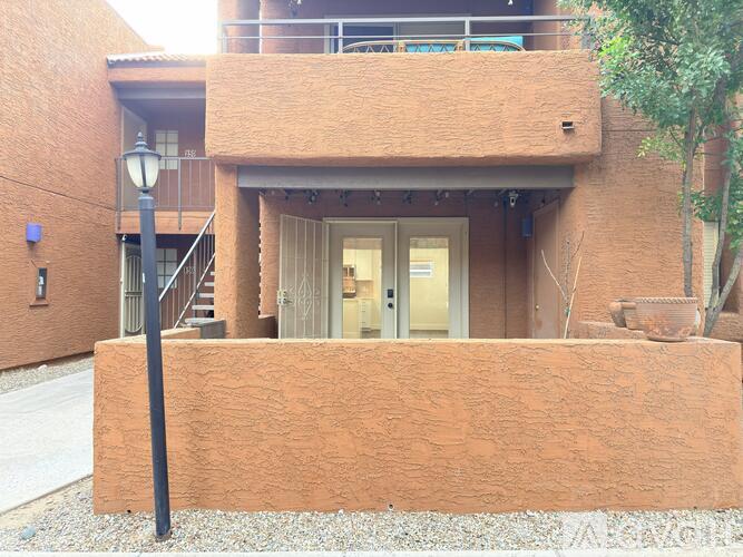 A building with a brown facade and a white door.