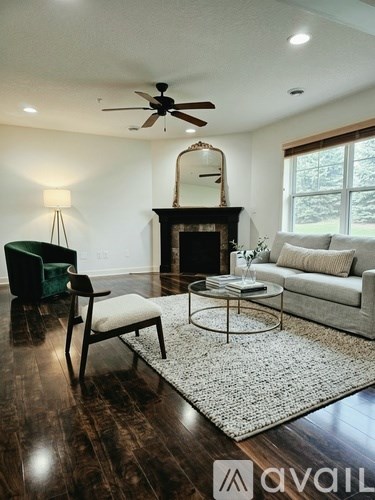 A living room with a fireplace and a couch.