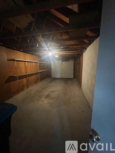 A room with wooden walls and a concrete floor.