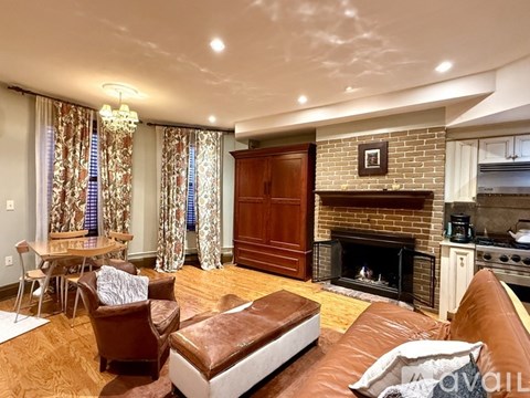 A living room with a fireplace and a couch.