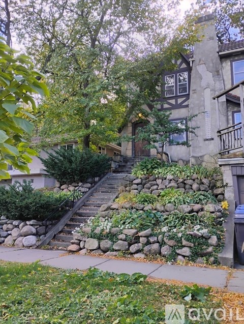 A stone staircase leads up to a house.