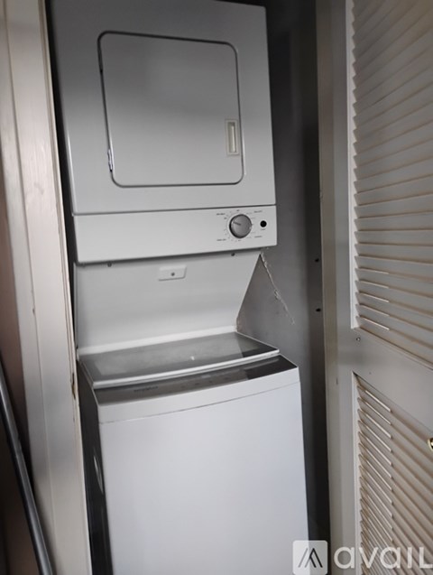 A white dishwasher is installed in a kitchen.