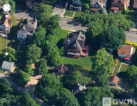 A bird's eye view of a residential area with houses and trees.