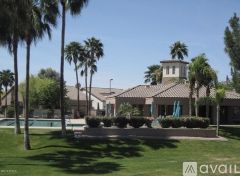 A large house with a pool in front of it.