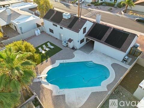 A house with a pool in the backyard.