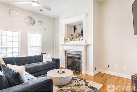 A living room with a fireplace and a couch.