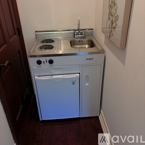 A small kitchen with Avanti appliances.