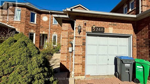 A brick house with the number 5248 on it.