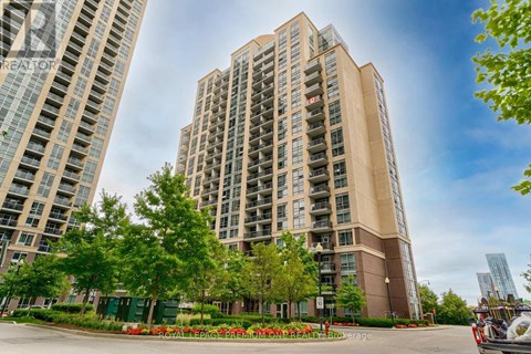 A tall building with a balcony on the 12th floor.