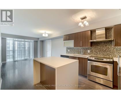 A kitchen with a stove top oven and a counter top.