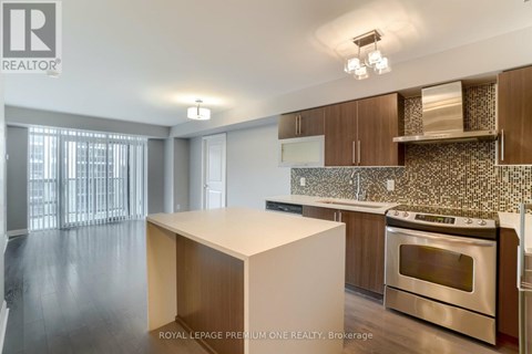 A kitchen with a stove top oven and a counter top.