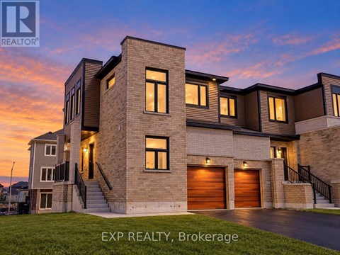 A modern house with a large front yard is for sale.
