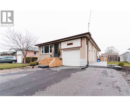 A house with a garage is for sale in Brokerage by Kigo Realty INC.