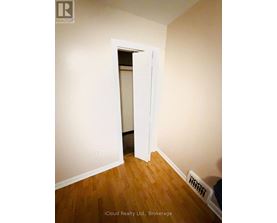 A room with a doorway leading to another room.